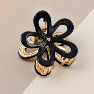 Pince à cheveux fleur ajourée acétate noir laqué monture dorée — ClawMeUp